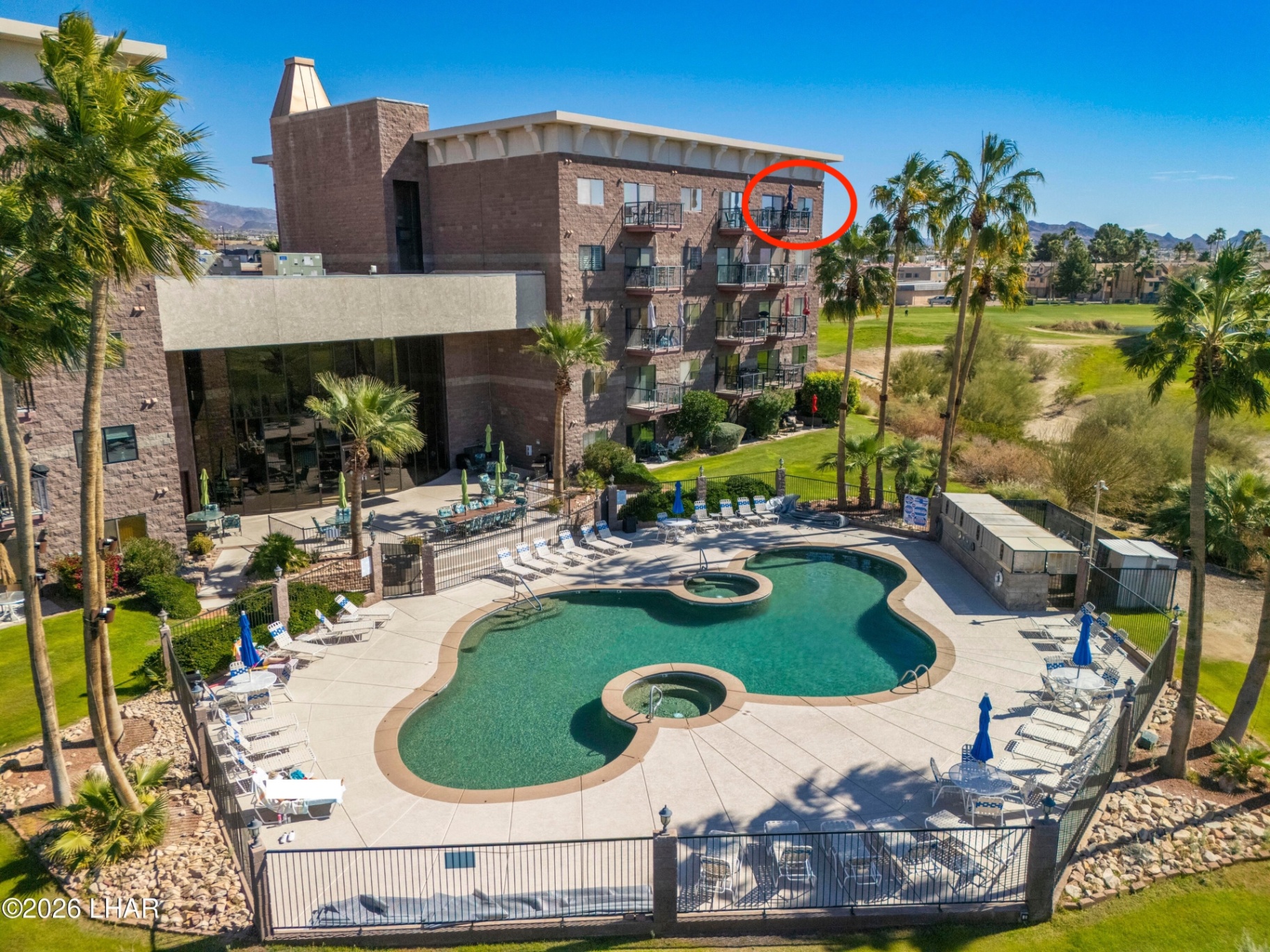 Tower view overlooking the resort pool and golf course